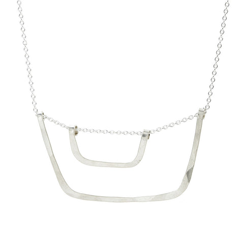 Freshie & Zero bucket and pail necklace featuring a miniature metal bucket pendant on a delicate chain.