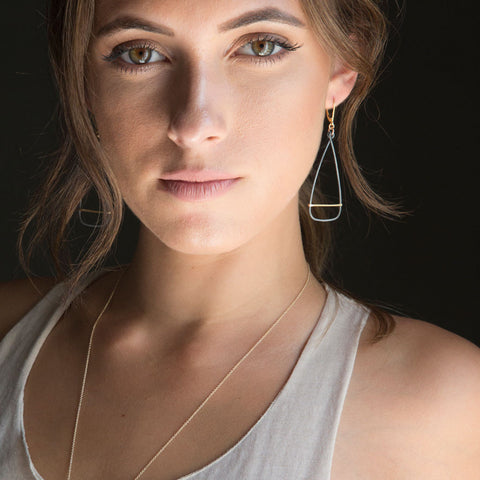 Antique oar earrings by Freshie & Zero featuring vintage-style metal oar charms hanging from ear hooks.