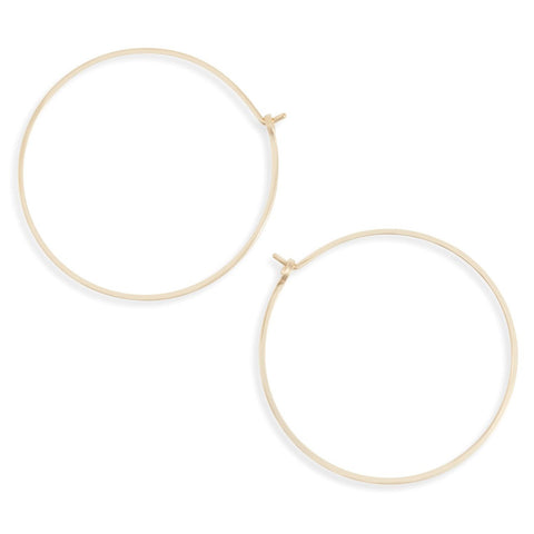 Large circular minimal hoop earrings by Freshie & Zero featuring sleek, modern design in shiny metal.
