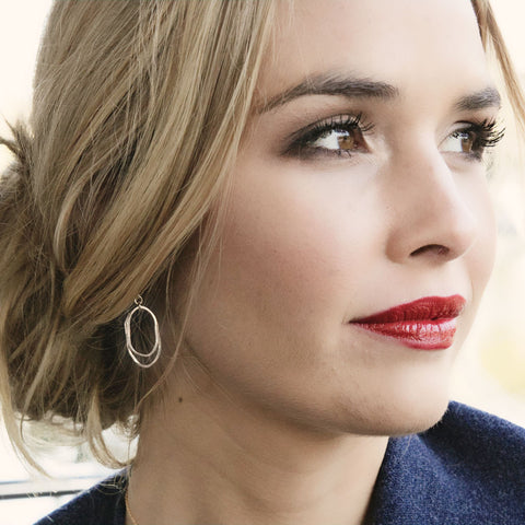 Simple flame earrings by Freshie & Zero featuring minimalist flame-shaped design in silver for stylish wear.