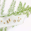 tiny handmade gold stud earrings by christina kober