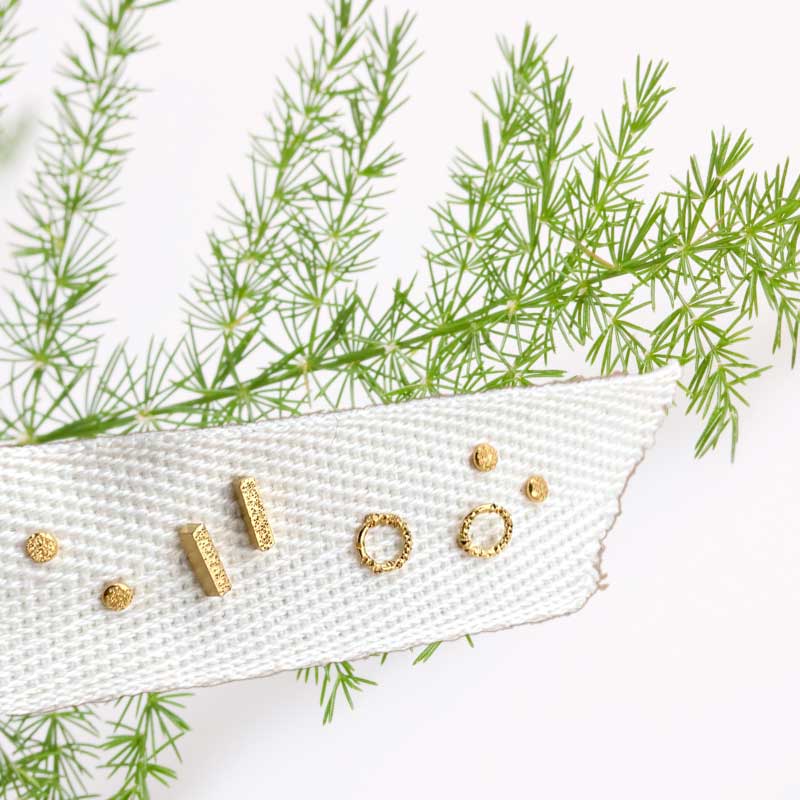 tiny handmade gold stud earrings by christina kober