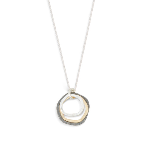 Mixed mini caldera necklace by Freshie & Zero featuring layered silver and gold-tone pendant necklaces on a delicate chain.