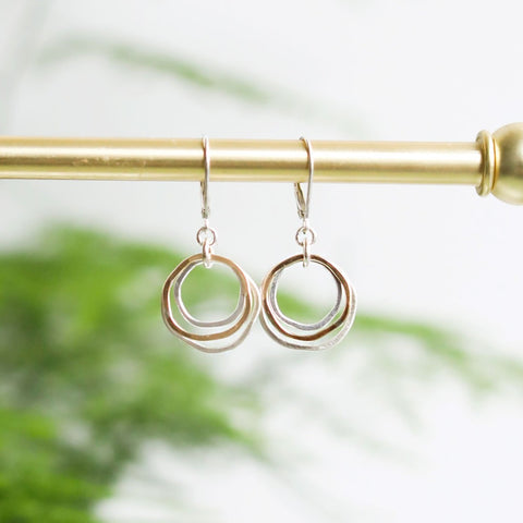 Freshie & Zero river rocks earrings featuring natural pebble designs and minimalist silver hooks, showcasing organic style.
