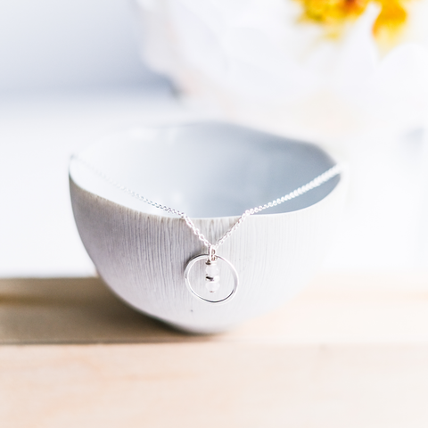 Freshie & Zero Seedling Cloud Necklace featuring a delicate cloud-shaped pendant on a fine chain.